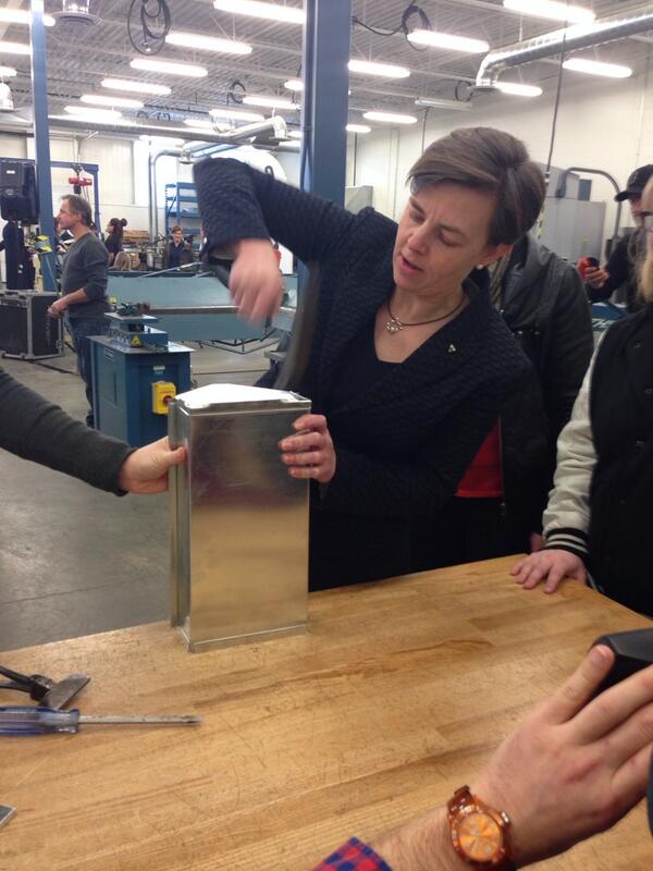 Minister Leitch tries her hand at a sheet metal work project following the CAWIC press conference.