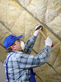 bigstock_Worker_thermally_insulating_a__26203589