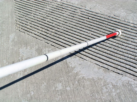 bigstock-White-cane-touching-ridges-on--26132705