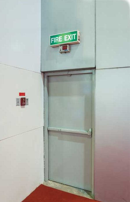 bigstock-fire-exit-door-104591699
