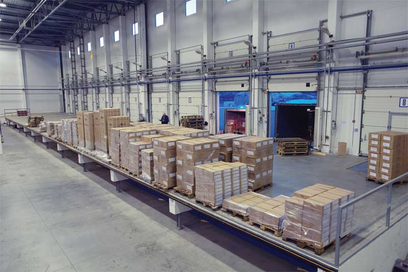 bigstock-unloading-system-inside-wareh-76195004
