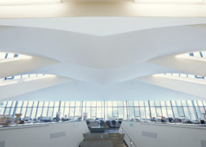 Designed to replicate wings, the angled drywall ceiling slabs gently twist from one side of the space to the other.