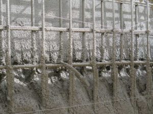In this image, voids are forming behind rebar during shotcrete application. Photo courtesy GCP Applied Technologies