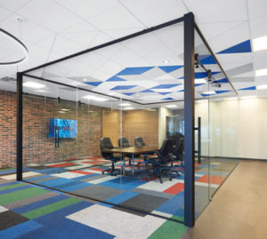 DESIGNFlex ceilings from Armstrong add colour to the glass-enclosed Max Games boardroom.