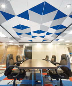 A combination of different coloured triangles and parallelograms add life to the boardroom.