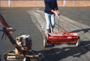 Figure 4: Xypex Concentrate Dryshake is a dry powder crystalline waterproofing product that is applied evening to freshly poured concrete and then worked into the surface with a power trowel and float.