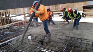 Activity on a construction site during the winter.