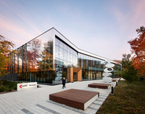 The view of the front facade of the Centre national intégré du manufacturier intelligent (CNIMI—integrated national center for intelligent manufacturing).