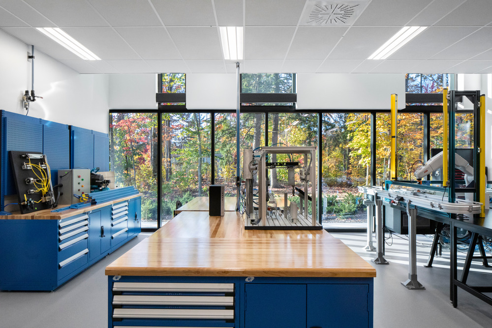 The manufacturing equipment with the forest as the backdrop.