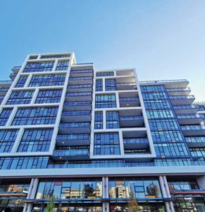 Aluminum-framed curtain wall, windows, and terrace doors were specified for this 12-storey, 126-unit, mixed-use residential development.