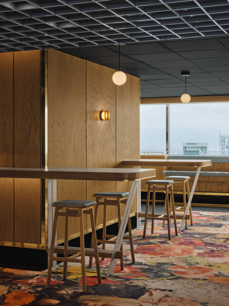 The floral carpet complements the wooden detailing.