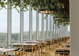 The use of wood, metal accents, and reflective surfaces is profuse in the restaurant.