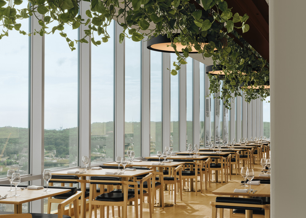 The use of wood, metal accents, and reflective surfaces is profuse in the restaurant.