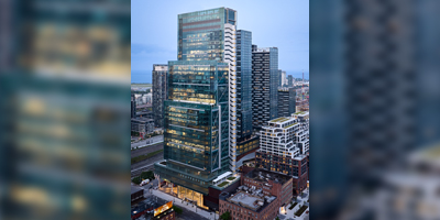 high rise building in a city with a glass exterior