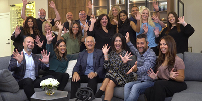 group of people with their arms stretched out