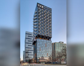 A mixed-use building in Toronto with the words 'TOOR' at the top