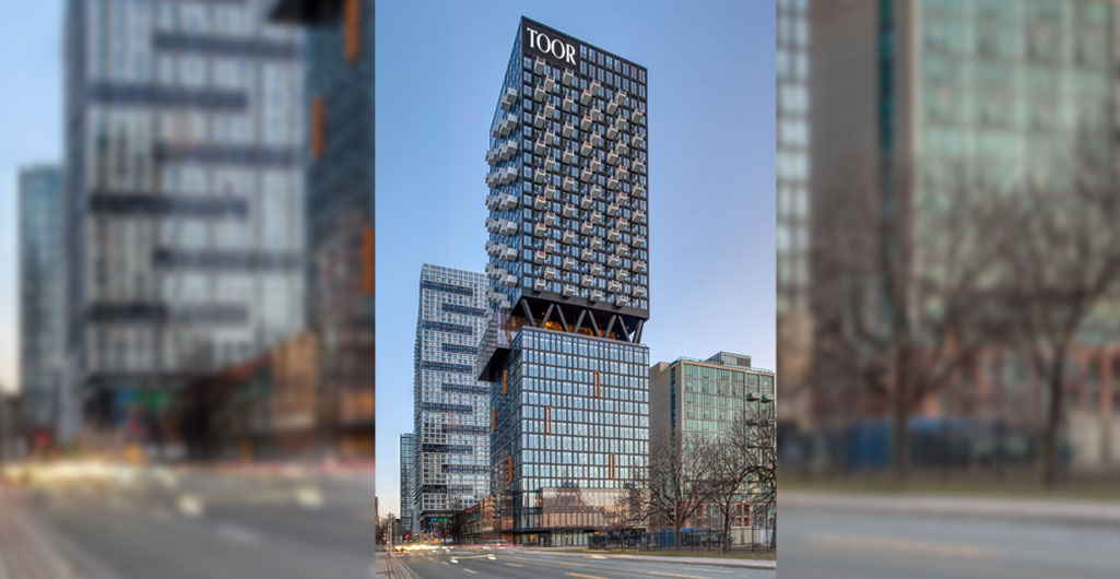 A mixed-use building in Toronto with the words 'TOOR' at the top