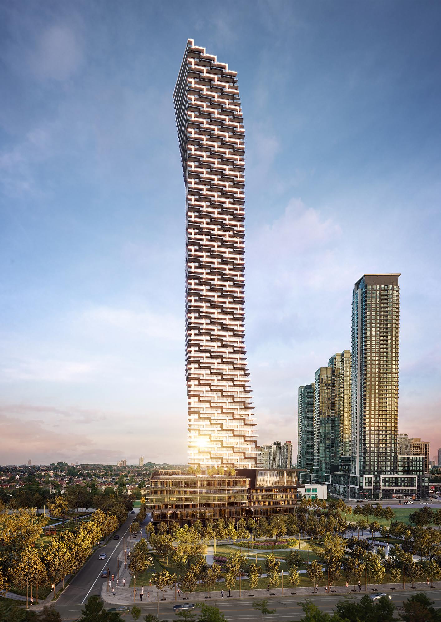 A modern, twisting skyscraper stands against a sunset sky, surrounded by urban buildings and green parkland.