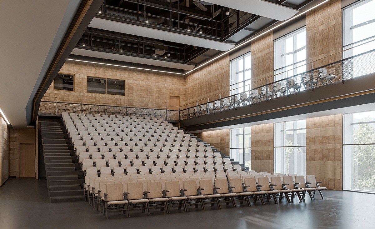 A modern auditorium with tiered seating, large windows, and a balcony area, featuring a neutral color palette and ambient lighting.