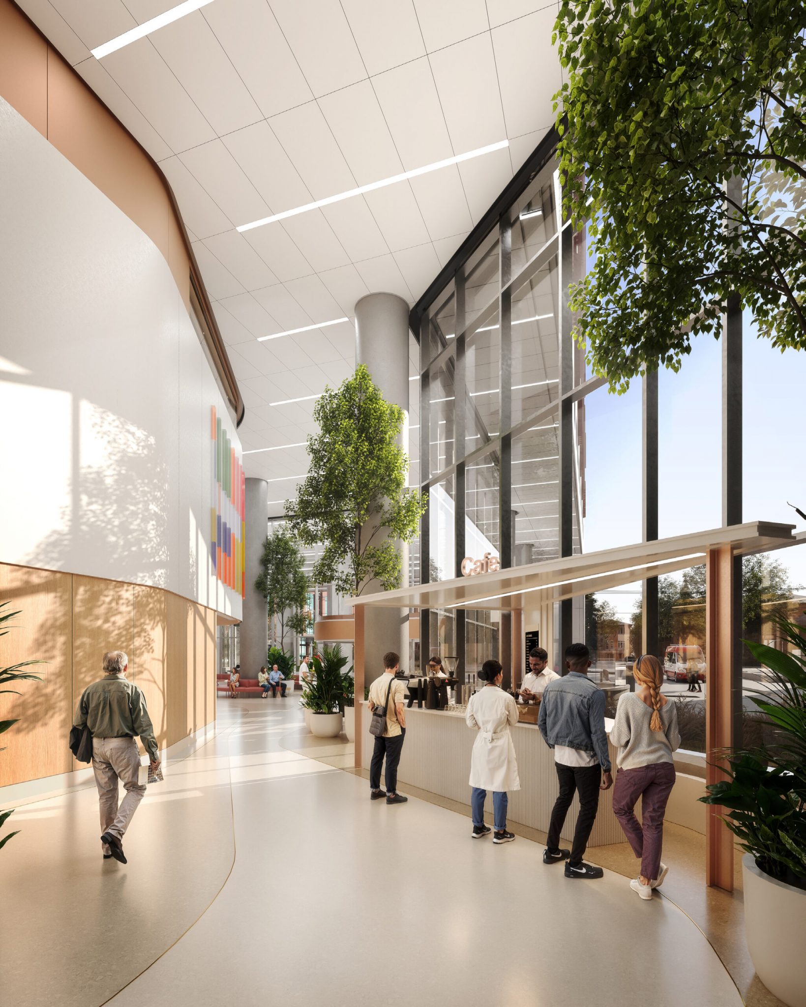 Modern interior of a spacious building with tall windows, greenery, and a café area where people are gathered.