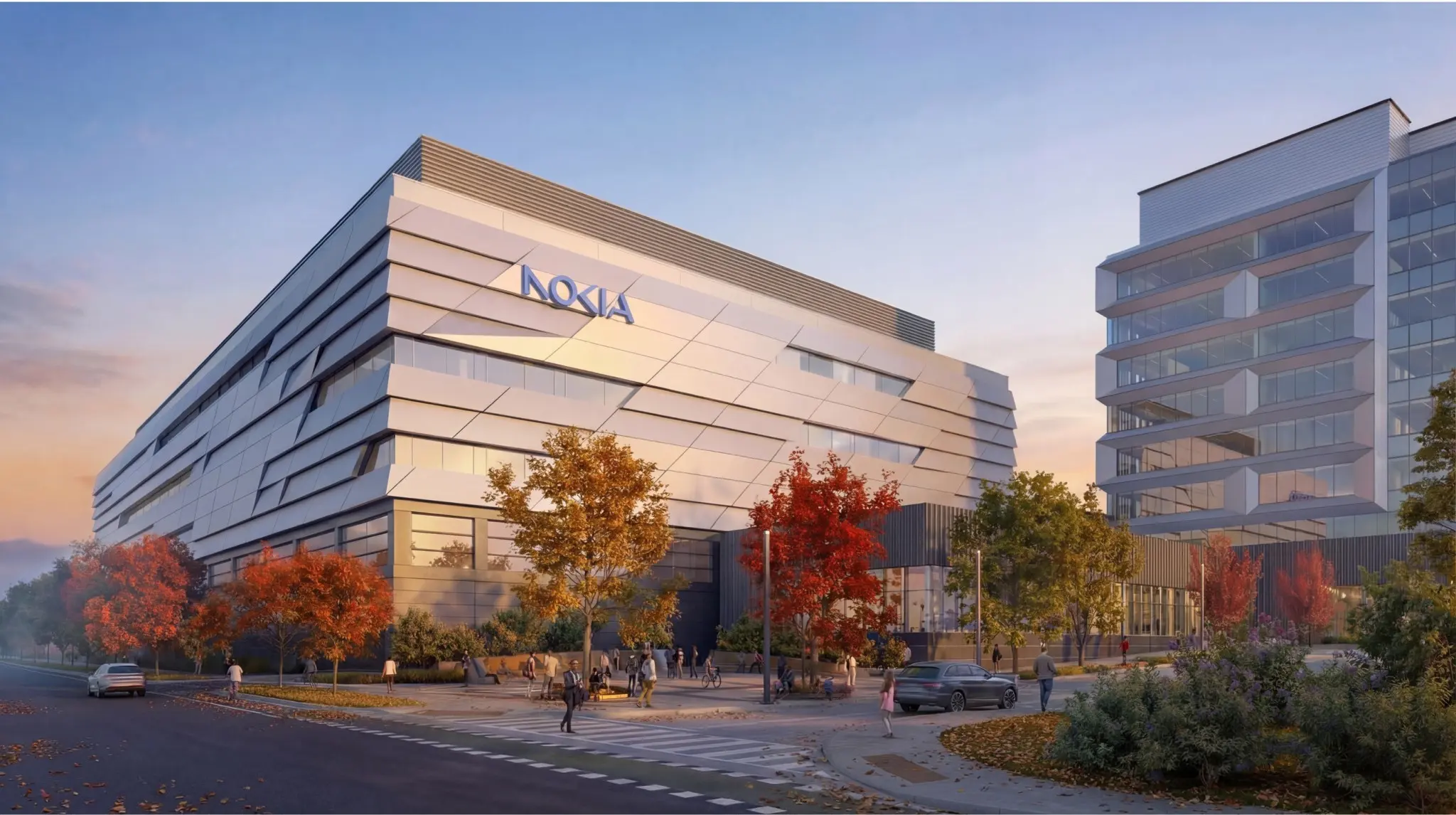Modern building with Nokia logo, featuring geometric design and large windows, surrounded by autumn trees at sunset, evoking a calm, innovative atmosphere.