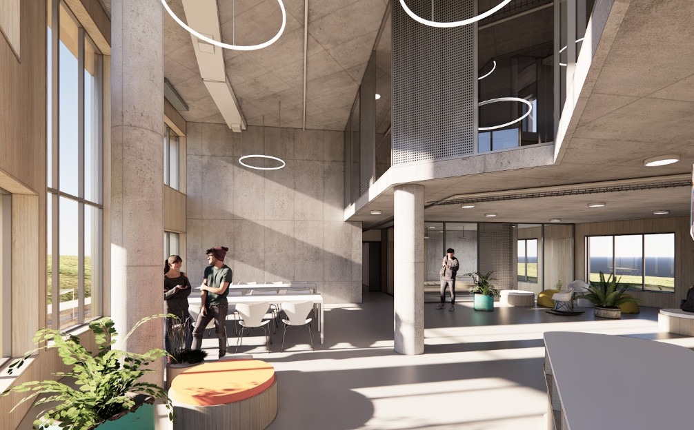 Modern interior with large windows, circular lights, and concrete walls. Three people converse near tables and plants, creating an open, airy atmosphere.